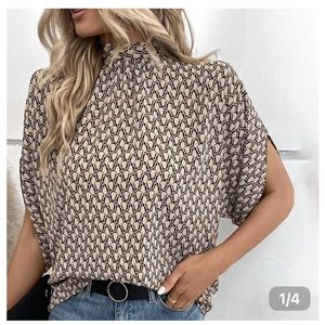 Blush and navy silk like blouse. Mock neck with tie at the back.